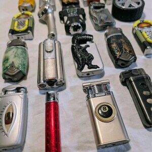 20 Refillable Pocket Lighters Cricket Tire Dino Jukebox  Eye  - Needs Fixing